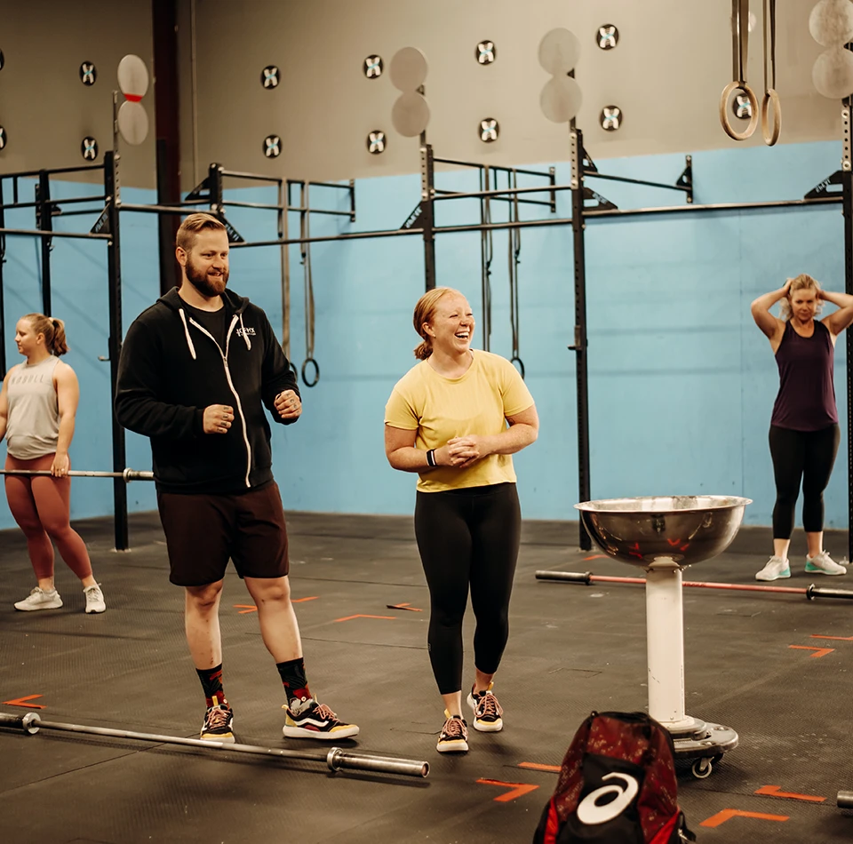 Women working out with coach at CrossFit in Greeley