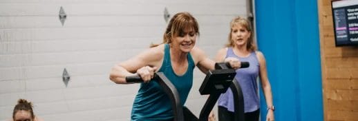 A woman exercises with expert guidance